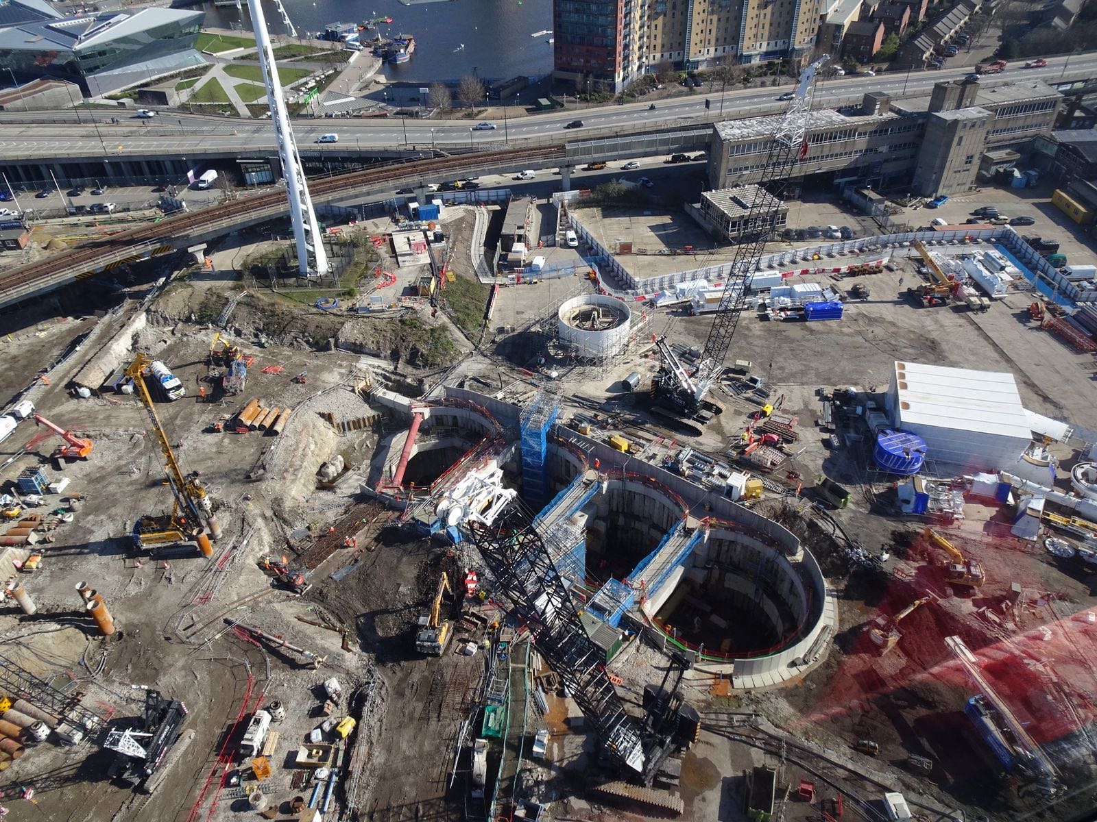 Aerial view of a large construction site with earthworks, plant and site compounds